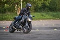 25-05-2020 Riga, Latvia. Motorcyclist goes on road, front view, closeup Royalty Free Stock Photo