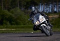 11-05-2021 Riga, Latvia Motorcyclist at sport bike rides by empty asphalt road. white sport bike. MotoGP race. Superbikes.