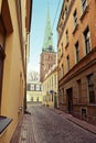 Riga, Latvia. Narrow medieval cobbled Maza Miesnieku iela street with tenement houses in the old town of Riga. Royalty Free Stock Photo