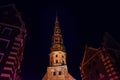 Riga, Latvia: Night View Of St. Peter`s Church In Old Town Riga Latvia. Illuminated Street Royalty Free Stock Photo