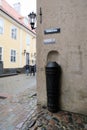 Riga, Latvia, November 2019. The barrel of the old gun protects the corner of the building from the impact of vehicles.