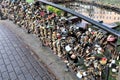 Riga, Latvia, November 2019. Iron castles as a symbol of the strength of marriage on the fence of the bridge.