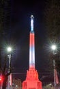 RIGA, LATVIA, NOVEMBER 17, 2017: Night view of the Freedom monument Brivibas piemineklis , decorated with fresh flowers