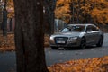 Riga, Latvia-October 6, 2021: Audi A8 driving on the city street during the beautiful autumn