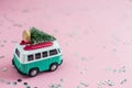 Riga, Latvia, October 31 2018. Hippie Bus with New Year Christmas Fir Tree on the Roof Miniature Small Car Banner