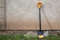 Digging spade at the wall of house from Fiskars collection