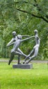 Park sculpture three graces reminiscent of red dancers Matisse Royalty Free Stock Photo