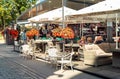 People enjoing the street bar in a hot autumn sunny day in old Riga, Latvia