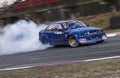 10-04-2022 Riga, Latvia Sport car wheel drifting. Blurred of image diffusion race drift car with lots of smoke from