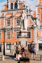 Riga Latvia Street Music Trio Band, Three Young Guys Playing Instruments For Donation On The Town Hall Square