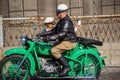 Couple with green Ural motorcycle participates at Riga Retro 2019