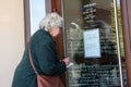 Seniors near PNB Bank entrance. Riga, Latvia. Royalty Free Stock Photo