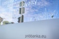 Slogan `Loyalty rewards` on window of PNB Bank