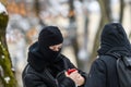 Young man wears balaclava, during cold winter day