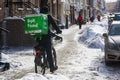 Bolt Food food delivery worker rides on bicycle