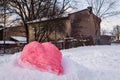 Snow figure created as a heart symbol to mark Valentine`s day