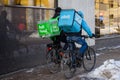 Wolt and Bolt Food food delivery workers rides on bicycle