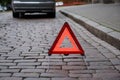 Emergency warning triangle ahead broken car Royalty Free Stock Photo