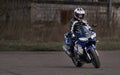 23-04-2020 Riga, Latvia. Woman riding a motorcycle on the road