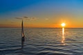 Riga, Latvia 12-06-2021 Yacht sailing against sunset. Holiday lifestyle landscape with skyline sailboat. Yachting