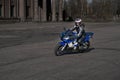 23-04-2020 Riga, Latvia. Young biker woman riding sport motorbike on road