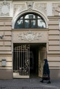 Riga, March, 2008, A person passing an entryway to an art nouveau building