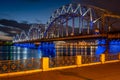 Riga railway bridge illuminated at night Royalty Free Stock Photo