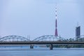 Riga Railway bridge with TV tower in background. Royalty Free Stock Photo