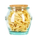 rigati pasta sedani rigati tubules. uncooked pasta in a glass jar. isolated on a white background.