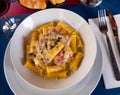 Rigatoni alla carbonara in cream cheese sauce with pancetta