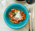 Rigatoni bolognese with fresh goat cheese