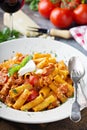 Rigatoni bolognese with fresh mozarella and basil