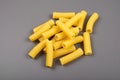 Rigatoni italian pasta isolated on grey background Royalty Free Stock Photo