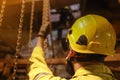 Rigger high risk worker crane operator wearing fall protection safety helmet Royalty Free Stock Photo