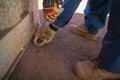 Rigger inspector hand wearing a glove inspecting a chain hook and yellow pig ear ensure are safety prior to lifting Royalty Free Stock Photo