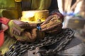 Rigger wearing a glove inspecting using blue plastic tag and tagging a heavy duty 2 tone chain hoist lifting equipment Royalty Free Stock Photo