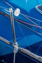 The rigging block with swivel and yellow rope. Part of the rigging of the yacht