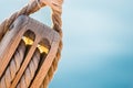 Rigging, maritime scene, close-up of wooden pulley with nautical ropes Royalty Free Stock Photo