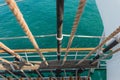 Rigging and part of the deck of a sailing vessel close-up against a background of sea water, top view Royalty Free Stock Photo