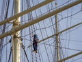 In a rigging of a sailing ship Climbing a man Royalty Free Stock Photo