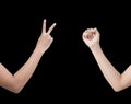 The right back and front side hand of the woman show Rock Paper Scissors sign for find the winners fair in the game. show rock or