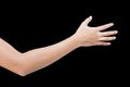 Right back hand of a woman trying to reach or grab something. fling, touch sign. Reaching out to the left. isolated on black Royalty Free Stock Photo