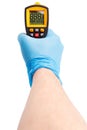 Right hand in blue medical latex glove aiming with yellow infrared contactless thermometer isolated on white, mockup