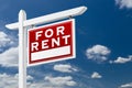 Right Facing For Rent Real Estate Sign Over Blue Sky and Clouds