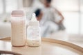 The right formula can aid in your babys development. Defocused shot of a young mother bottle feeding her daughter on the