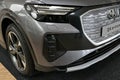 Right front view of front mask of german compact luxury battery electric crossover SUV car Audi Q4 e-tron Royalty Free Stock Photo