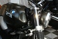 Right front view of fuel tank, headlight and telescopic forks on modern german roadster motorcycle BMW R NineT Scrambler