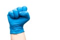 Right hand of doctor with blue protecting glove gesturing with fist