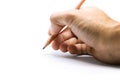 Right hand hold up brown wood pencil write on white background Royalty Free Stock Photo