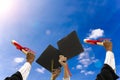 The right hand holds degrees in to sky. Royalty Free Stock Photo